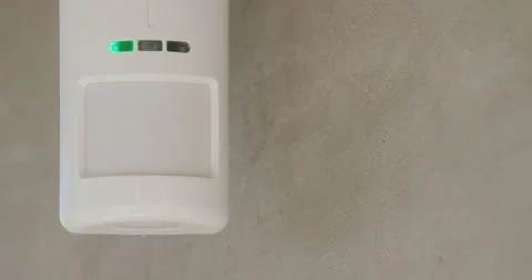 Security alarm sensor on the wall of the house. Stock Footage 136552342