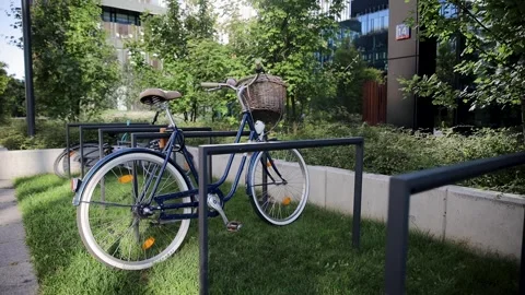 Security and anti-theft lock for bicycle.Outdoor parking lot in european city Stock Footage 262141925