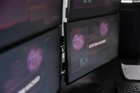 Security breach error and cyber crime attack flashing on computer monito Stock-Fotos