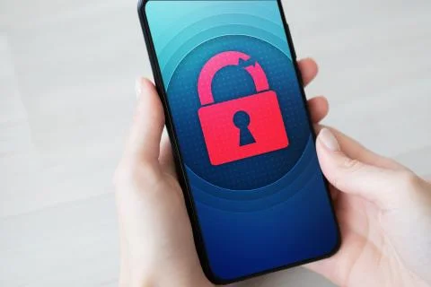 Security breach unlock padlock icon on mobile phone screen. Cyber protection 库存照片