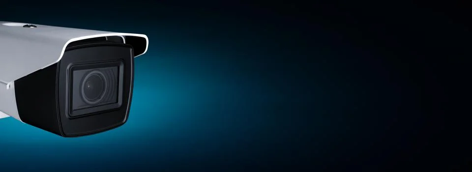 Security camera against dark background with space for text. Stock Photos