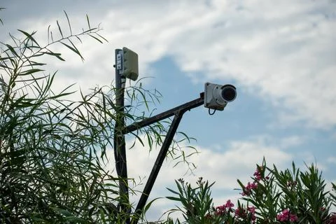 Security Camera and Antenna on Pole with Sky Background Stock Photos