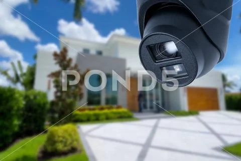 Security camera and private house on the background. Stock Image #247085256