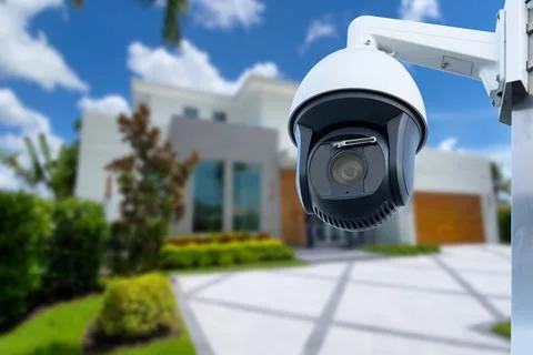 Security camera and private house on the background. Stock Photos
