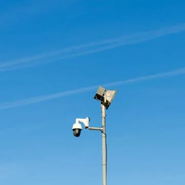 Security camera and street light monitoring public safety Stock Photos