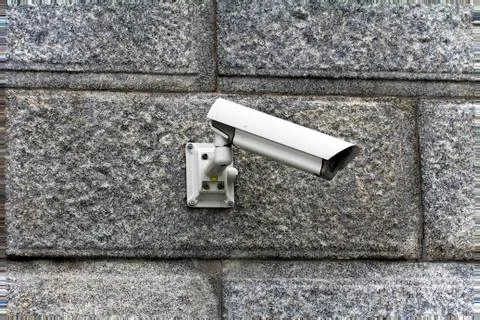 Security camera attached to the wall Stock Photos