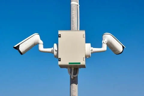 Security camera on a blue background private protection Stock Photos