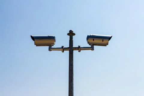 Security camera on blue sky background Stock Photos