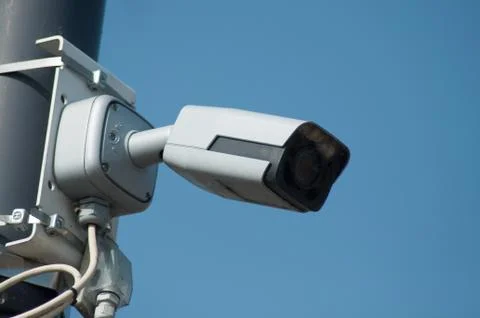 Security camera on blue sky background Stock Photos