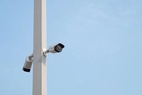 Security camera with blue sky. Stock Photos