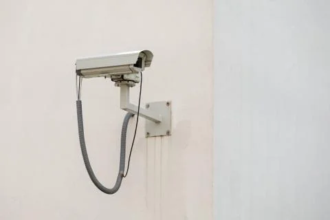 Security camera on bright wall Stock Photos