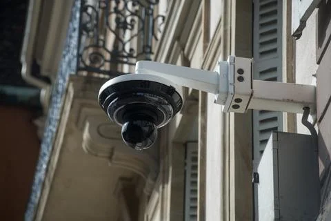 Security camera on building facade in the street Stock Photos
