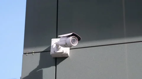 Security camera on the building wall in 4k slow motion 60fps Stock Footage 152570921