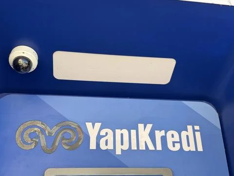 Security camera captures yapi kredi atm in turkey with blue background Stock Photos
