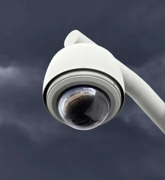 Security camera with dark thunderstorm sky Stock Photos