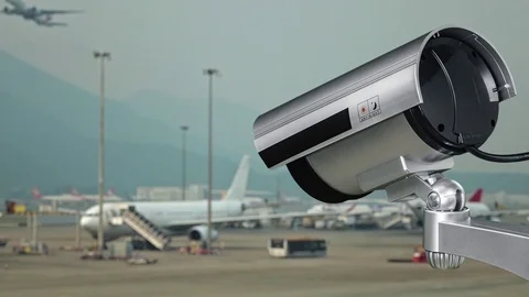 Security camera at day on the runway with airplanes in the international airport Stock Footage 83231667