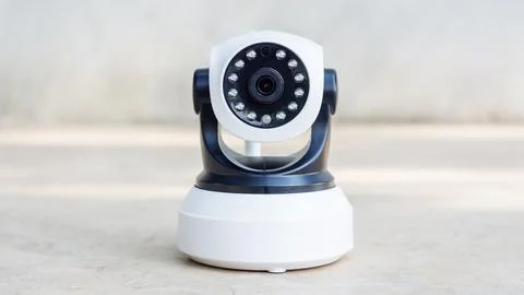Security camera on a gray background. Stock Photos