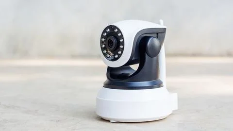 Security camera on a gray background. Stock Photos