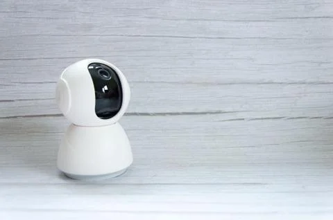 Security camera on grey wood table. CCTV , ip camera Security monitoring play Stock Photos