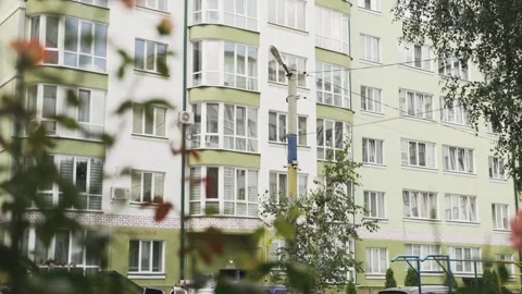 Security camera hanging on the utility pole in the yard of the apartment block Stock-Footage 149128069