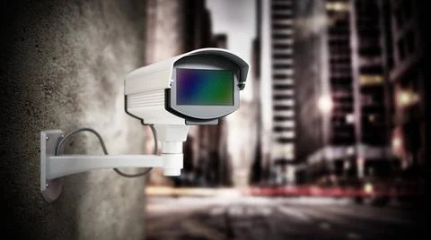 Security camera hanging on the wall against city background. 3D illustrati... Stock Photos