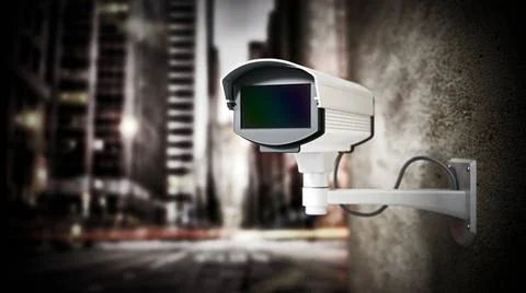 Security camera hanging on the wall against city background. 3D illustrati... Stock Photos