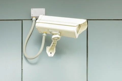 Security camera on home wall, Private property cctv protection Stock Photos