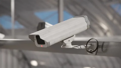 Security camera installation in modern warehouse building with metal casing Stock Footage 323735665