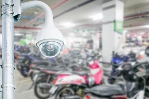 Security camera installed on blur car park, indoor use, of cctv to record Foto stock
