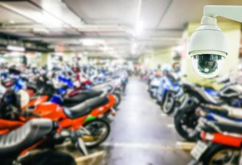 Security camera installed on blur car park, indoor use, of cctv to record Stock Photos