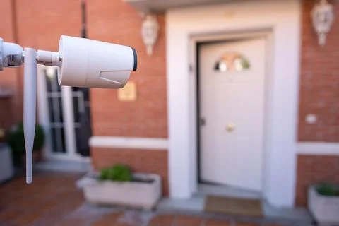 Security camera installed in the garden of a house for the surveillance of the Stock Photos