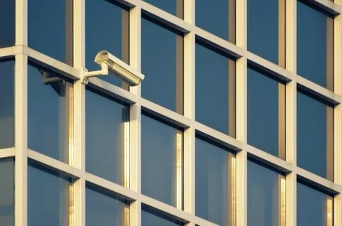 Security camera on a modern building facade Stock Photos