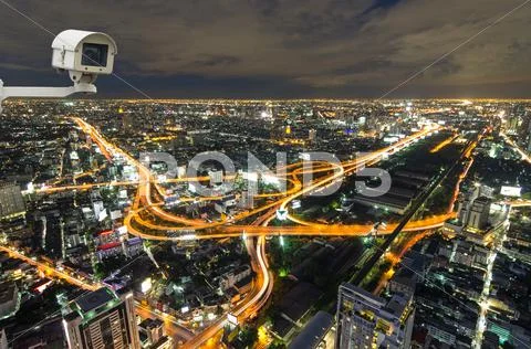 Security Camera Monitoring The Traffic Movement On Top View Of Cityscape. Sky