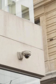 Security camera monitors street area in urban setting Stock Photos