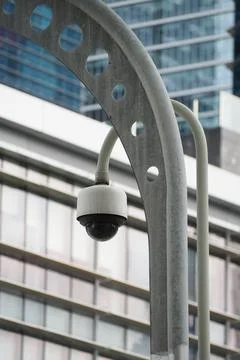 Security camera mounted on a city building Stock Photos