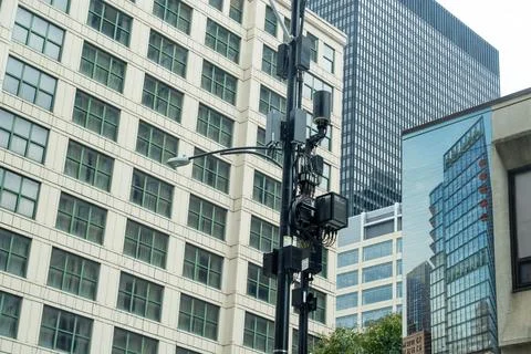Security camera mounted on a city pole among multiple cameras and connected.. Foto stock