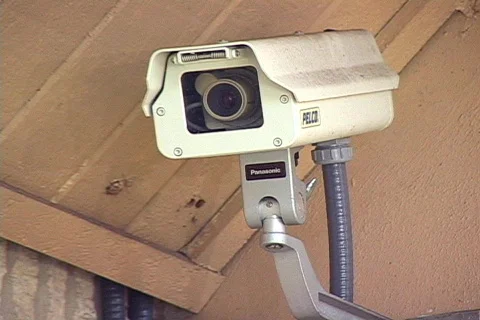Security Camera Mounted on the Side of a Building Stock Footage 141517