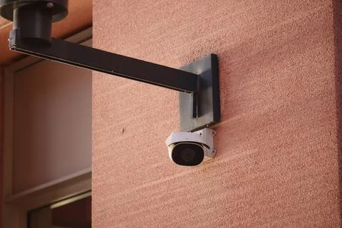Security camera mounted on wall for surveillance purpose Stock Photos