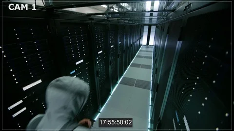 Security Camera N1 Footage of Hacker in a Hoodie Inflitrating Data Center Video stock 73875791