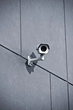 Security camera on office building wall Stock Photos