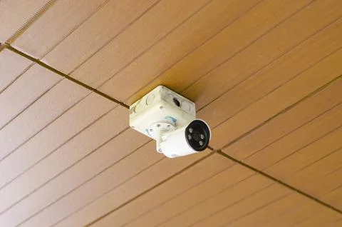 Security Camera, Old white have dusty CCTV on the wall in city or buildings Stock Photos