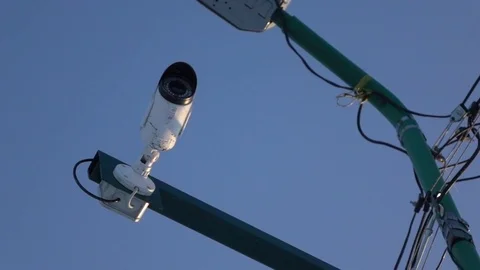 Security camera on a pole with wires. Bottom view 動画素材 85367630
