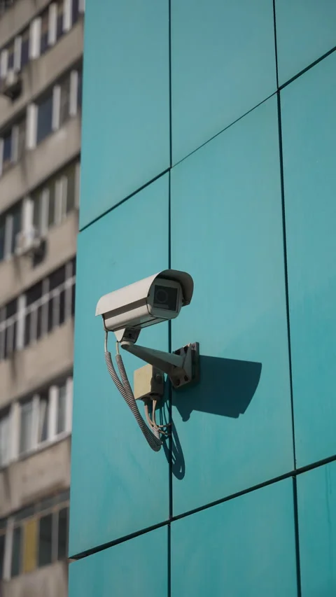 Security camera slowly panning across turquoise tiled surface, electronically Stock Footage 305496856