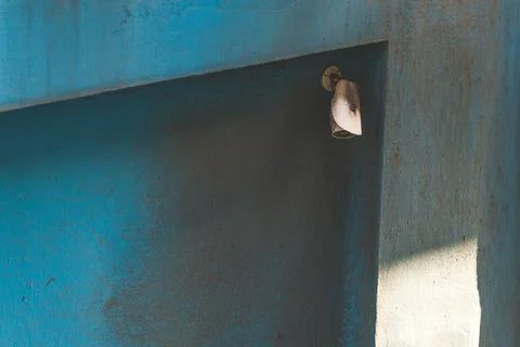 Security camera system mounted on old dirty blue concrete wall Stock Photos