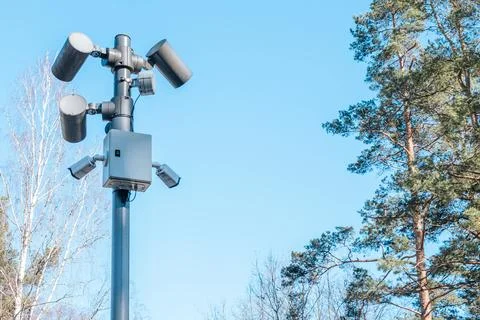 Security camera system mounted on a tall pole with multiple sensors. 写真素材