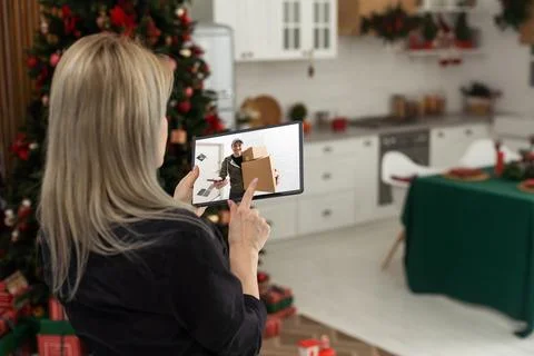 Security camera system on tablet app - Delivery man holding package in front of Stock Photos