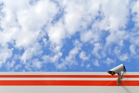 Security camera on the wall of the building Stock Photos