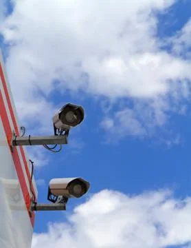 Security camera on the wall of the building Stock Photos