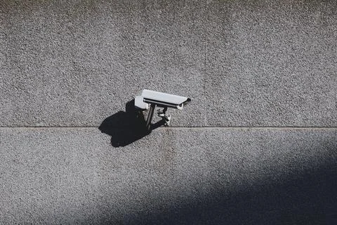 Security camera on the wall of the building Stock Photos