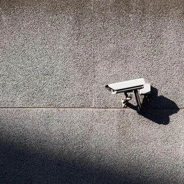 Security camera on the wall of the building Stock Photos